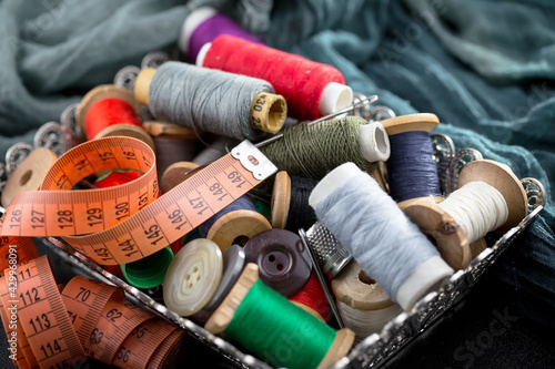 Threads, needles and sewing items.