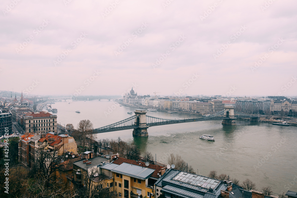 Panoramic view of the Szechenyi Chain Bridge and old buildings on the embankment in Budapest