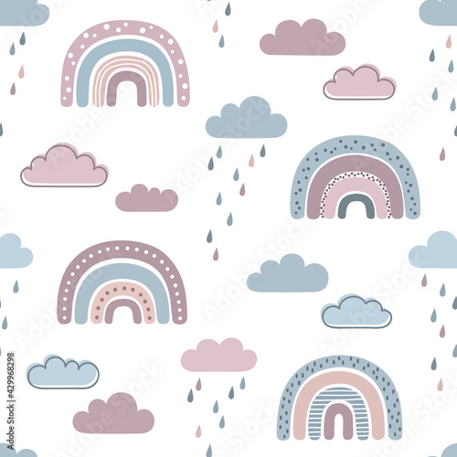 Seamless pattern with rainbows, clouds and raindrops in naive, childlike, Scandinavian style