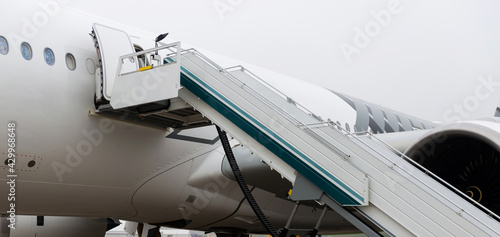 Large passenger jet with ladder. Airplane part