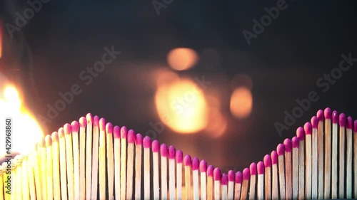 concept and idea matchstick burning with wave line and dark background photo