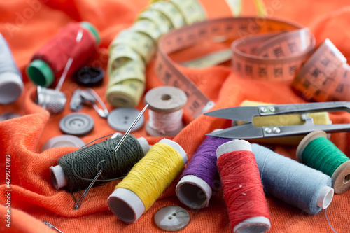 Threads, needles and sewing items.