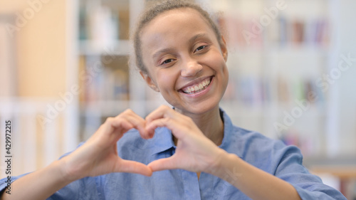 Portrait of African Woman showing Heart Sign with Hands