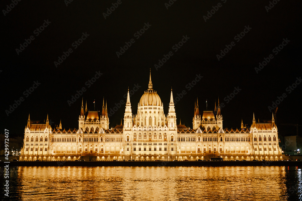 Parliament building in beautiful night illumination in Budapest. Front view