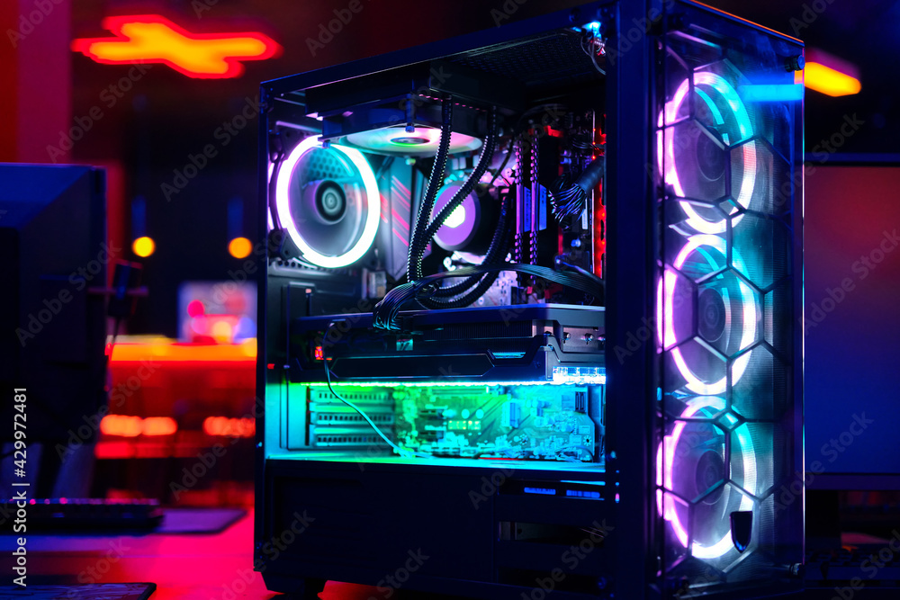 Top-end system unit for gaming computer close up. Inside of illuminated  cybercafe. Concept of modern tech, fun, esport, online video games internet  cafe Photos | Adobe Stock