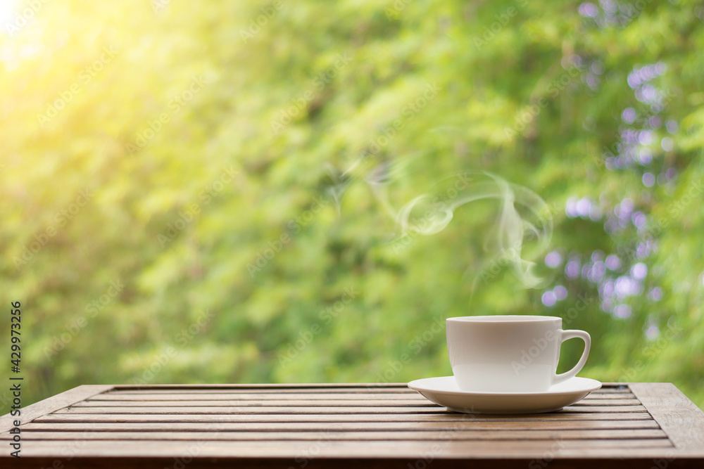 Coffee espresso on wood table nature background in garden,warm tone Coffee espresso on wood table nature background in garden,warm tone