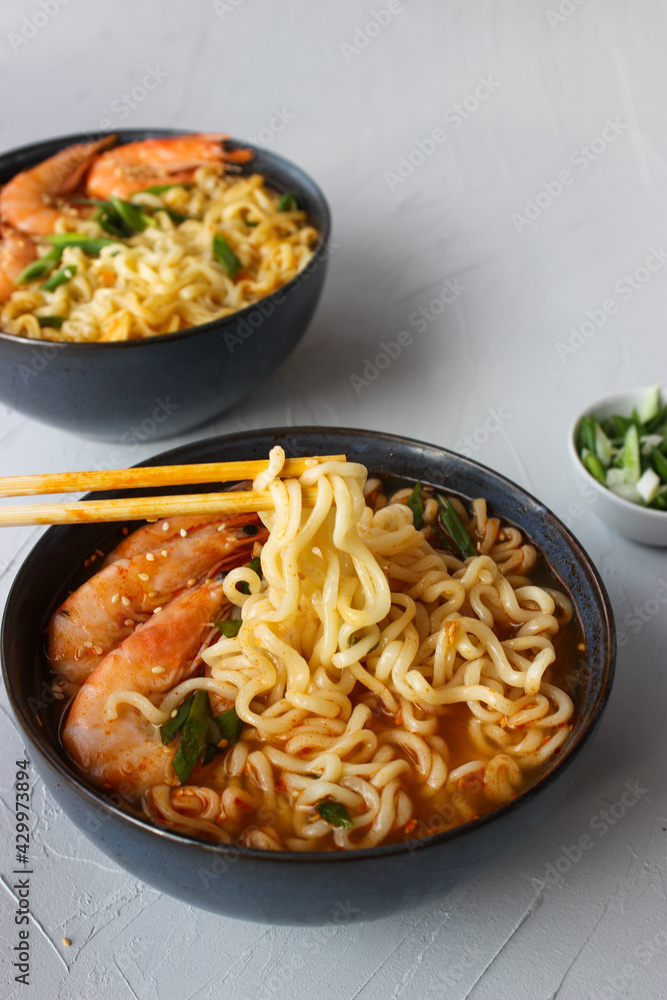 Ramen soup with prawns and green onions.