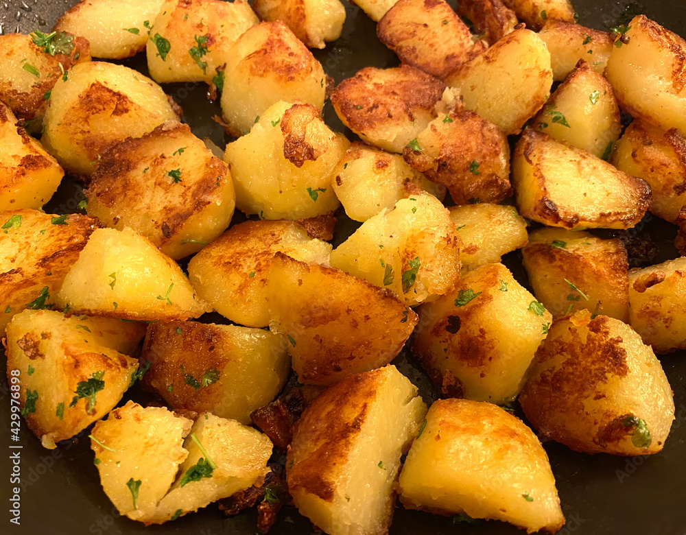 Crispy pan fried potatoes with parsley. Crispy pan fried potatoes with parsley.