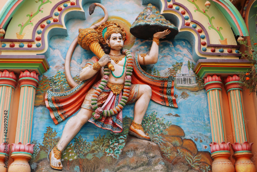Hanuman, servant of Rama and Sita, carries the mountain. Wall art in Mayapur, India, March 14, 2019. - obrazy, fototapety, plakaty 