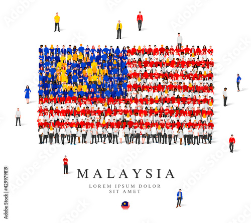 A large group of people are standing in blue, yellow, white and red robes, symbolizing the flag of Malaysia.