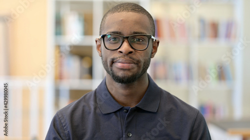 Portrait of Serious Young African Man Looking at the Camera