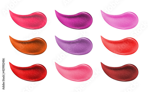 Collection of various smears lipstick isolated on white. Beauty and cosmetics background. Pink lip gloss strokes
