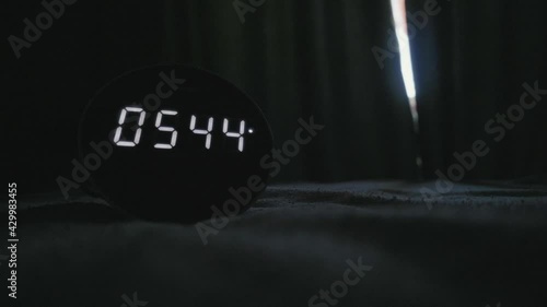 morning alarm clock in a dark room photo