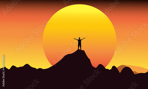 A man standing on the top of the peak, signifying the triumph of business, the highest point.