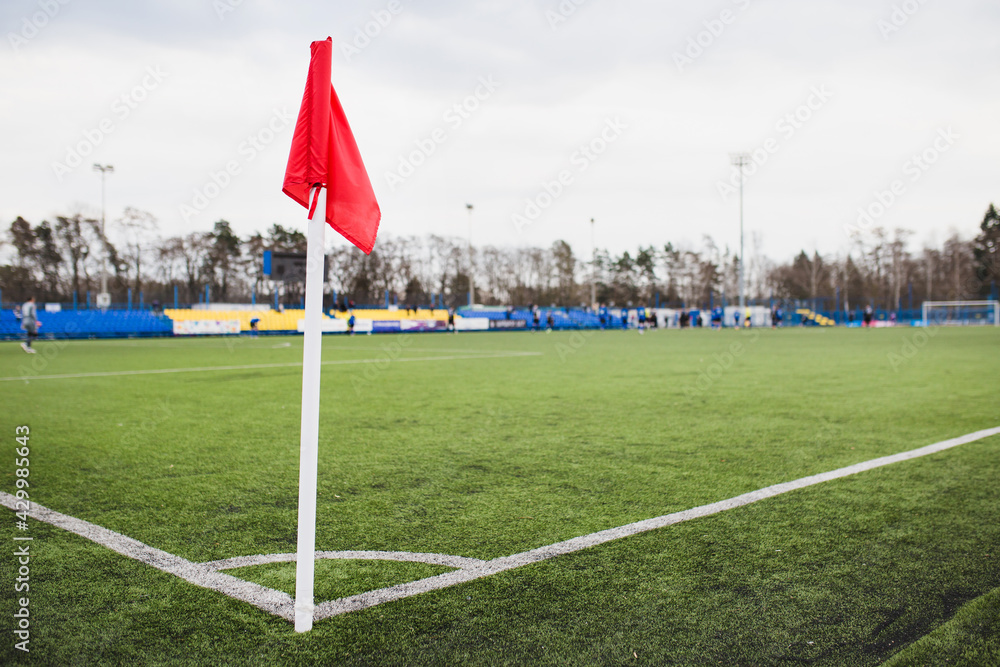 Corner red flag on soccer field - stadium competition - obrazy, fototapety, plakaty 