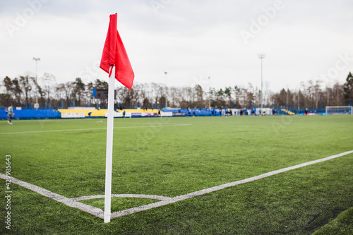 Corner red flag on soccer field - stadium competition