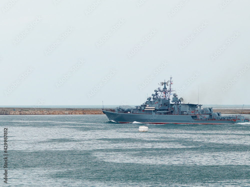 Russian military ship warship in bay.