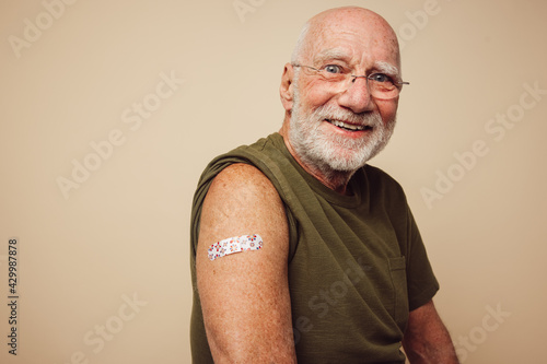 Portrait of senior man after getting vaccine