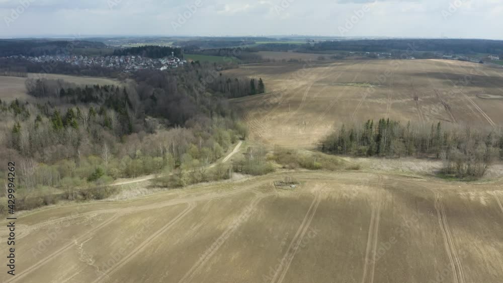 Aerial view of agricultural landscape with fields in spring season. Beautiful rural landscape in bird's-eye view.
Aerial view of agricultural landscape with fields in spring season. Beautiful rural landscape in bird's-eye view.