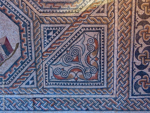 Decorative corner with geometric ornamented borders of Roman floor mosaic which is freely accessible for everybody outdoors in Vitchen, Luxembourg