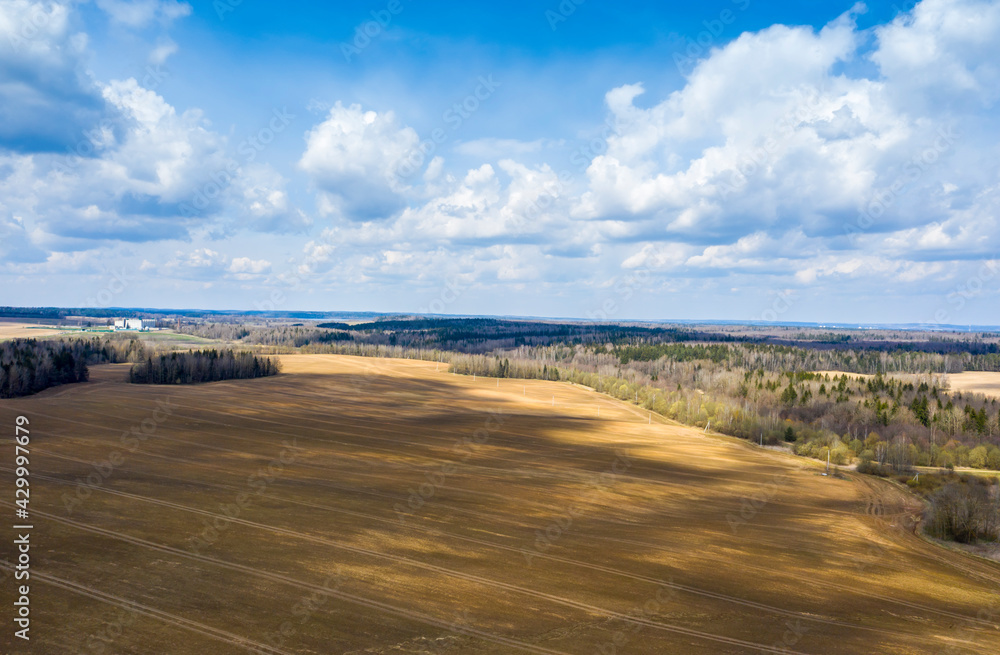 Aerial view of agricultural landscape with fields in spring season.