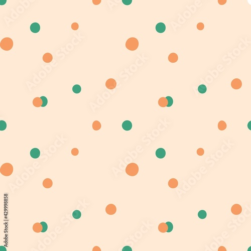 Doodle dots seamless pattern. Hand drawn decor textile cute ornament peach and green circles on pastel background. Abstact simple childish texture. Wrapping paper wallpaper vector print or fabric