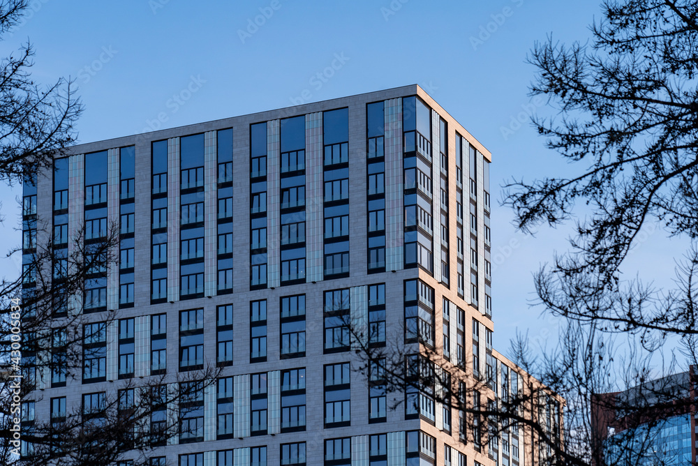facade of a modern office residential building against the sky facade of a modern office residential building against the sky
