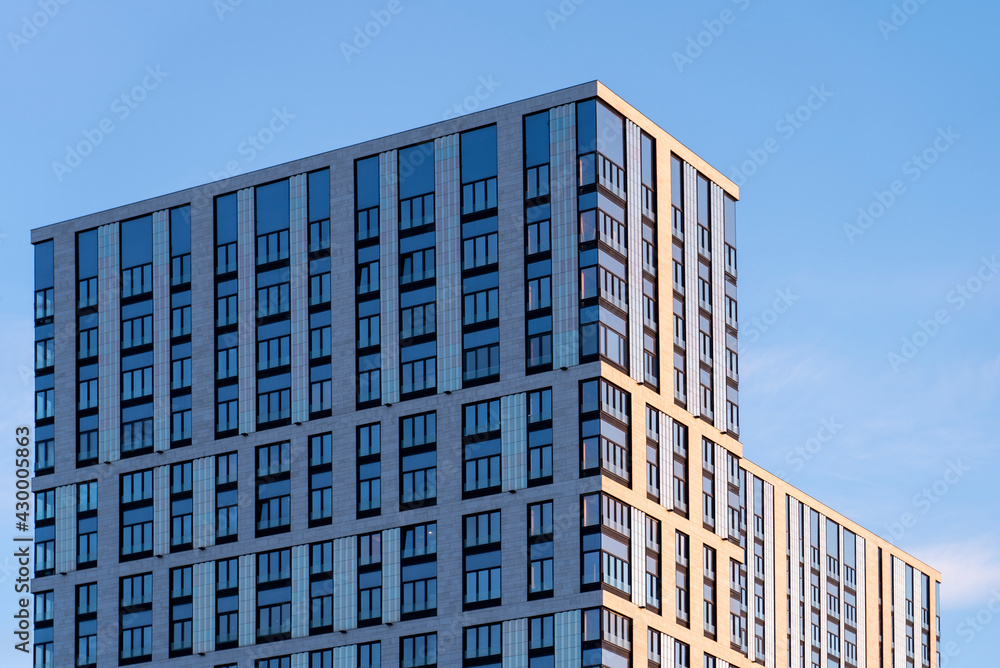facade of a modern office residential building against the sky facade of a modern office residential building against the sky