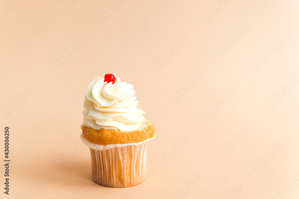 Homemade cupcake with cream beige background Homemade cupcake with cream beige background