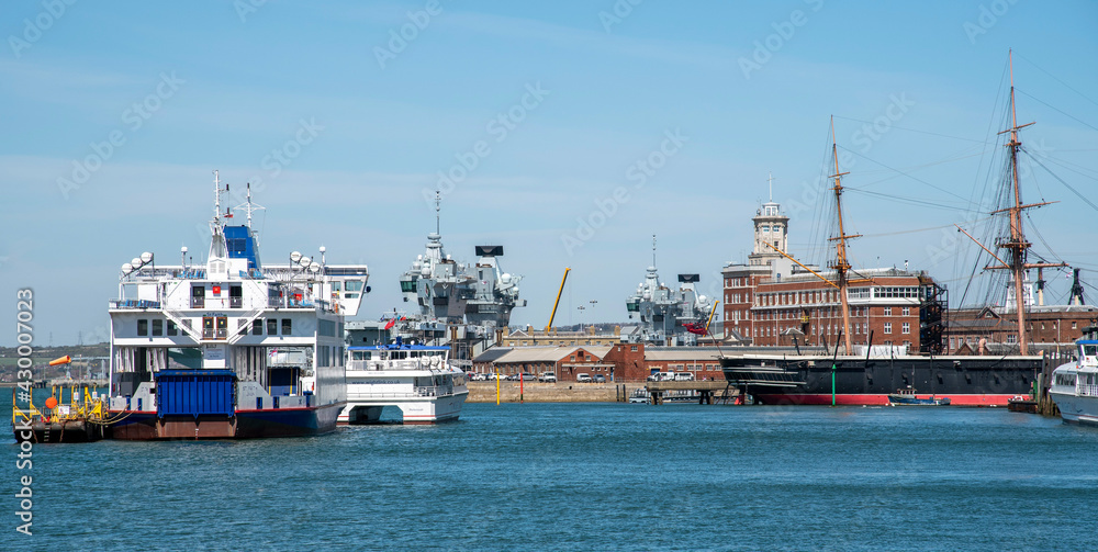 Portsmouth Harbour, England, UK. 2021.  Shipping on Portsmouth Harbour, ferries, military ships and Warrior a popular tourist venue and the dockyard.