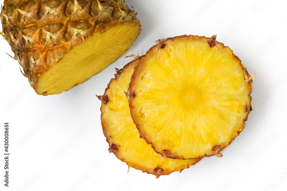 Ananas comosus. Pineapple slices and whole pineapple isolated on white background, top view