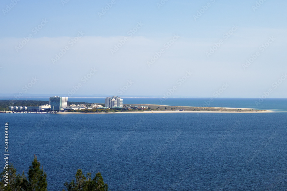 View of the tourist resort of Troia, in Portugal, with the marina and the hotel buildings. Beaches and the Atlantic Ocean.