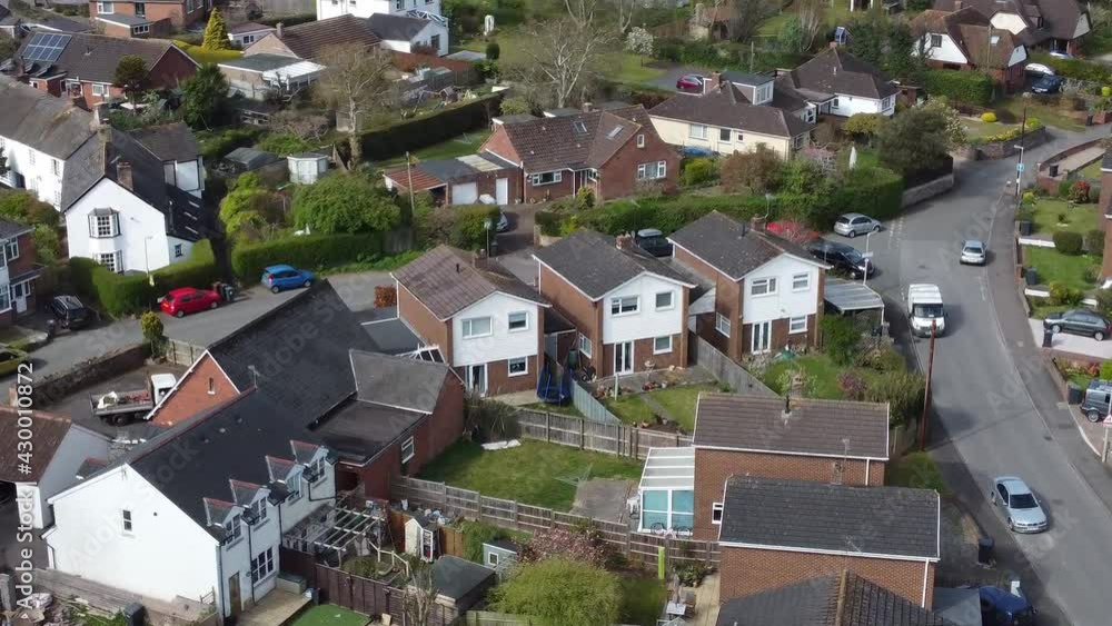 Aerial drone close up flying over rural suburb village houses in Exeter, England Aerial drone close up flying over rural suburb village houses in Exeter, England