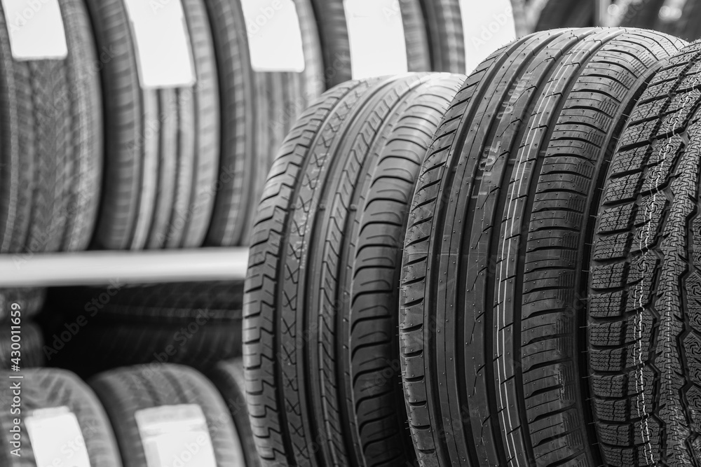 new tires in the service shop against the blurred tire background new tires in the service shop against the blurred tire background