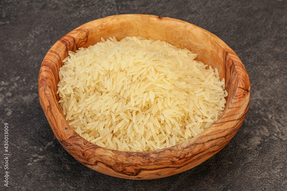 Raw basmati rice in the bowl Raw basmati rice in the bowl