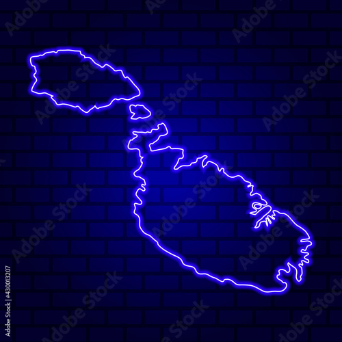 Malta glowing neon sign on brick wall background