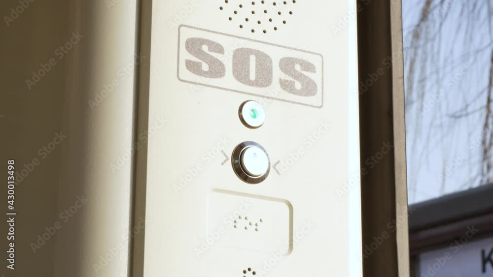 SOS signal button inside the tram, train, emergency help system push button, Braille inscription, detail, closeup Public transport safety, urban transportation security, accessibility abstract concept SOS signal button inside the tram, train, emergency help system push button, Braille inscription, detail, closeup Public transport safety, urban transportation security, accessibility abstract concept