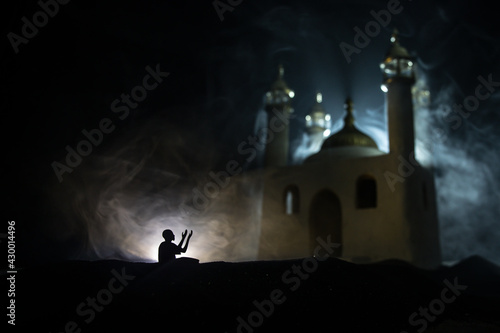 Wallpaper Mural Silhouette of mosque building on toned foggy background. Ramadan Kareem background. Mosque at sunset. Praying people Torontodigital.ca