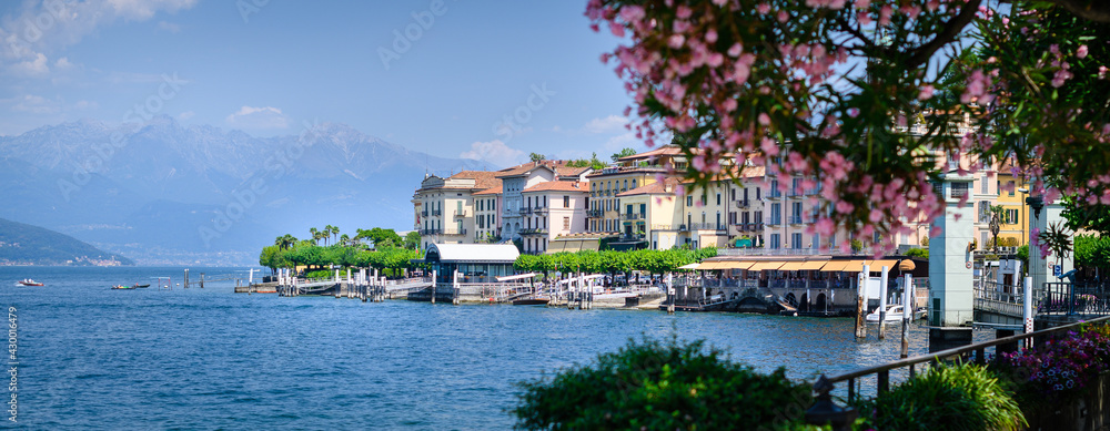 Bellaggio landscape, blue sky, pink floral in foreground