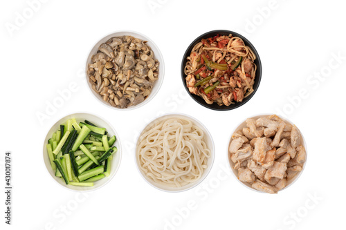Asian wok noodles on white background. Wok noodles close-up, top view. A set of products for making wok noodles.