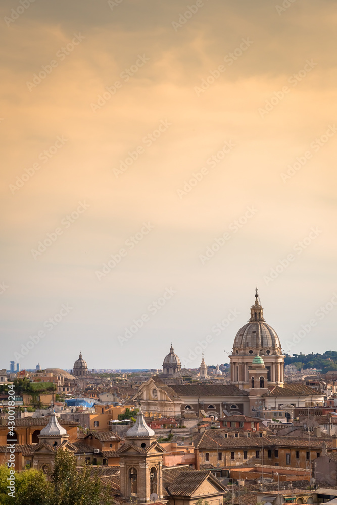 Rome cityscape with sunset sky and clouds, Italy