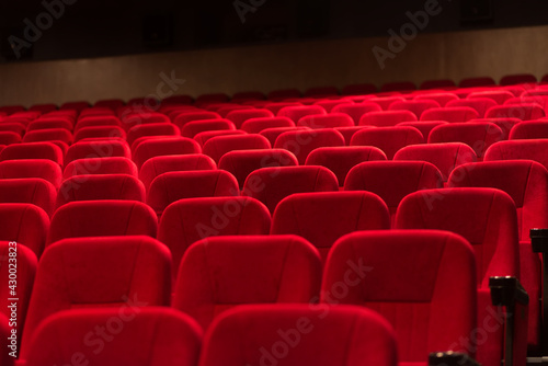 An empty cinema room with red velvet seats. Empty cinema.