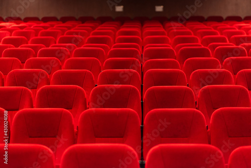 An empty cinema room with red velvet seats. Empty cinema.