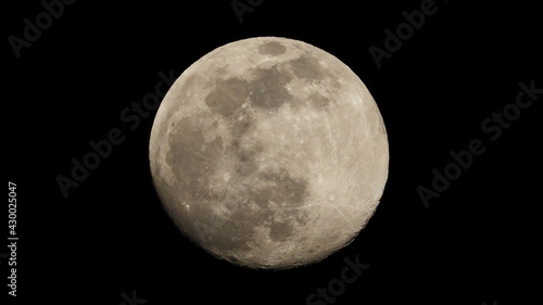 Zoom photo of full moon as seen at night