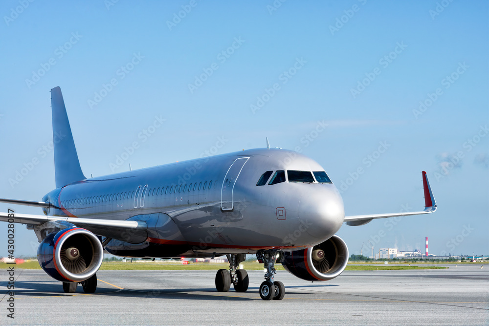 A big jet on its runway getting ready for taking off at airport. A big jet on its runway getting ready for taking off at airport.