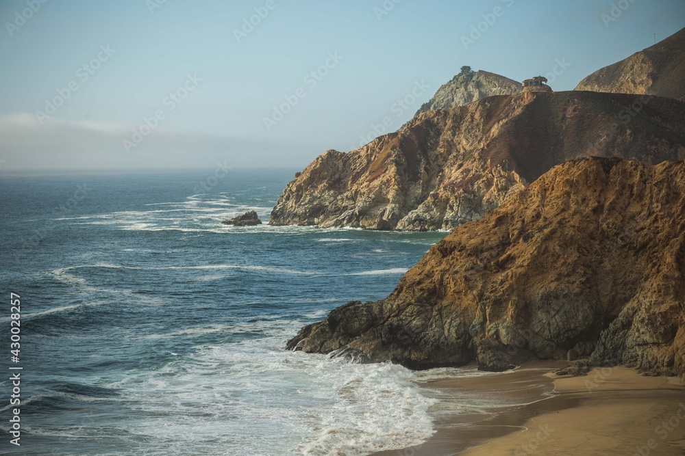 Coastal Rocky Cliffs Facing the a Blue Ocean