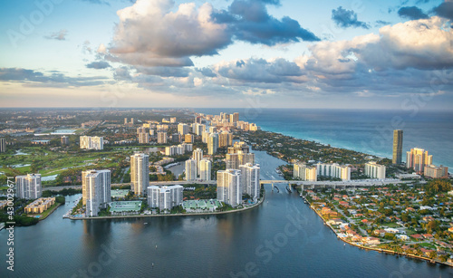 Helciopter view of Miami Beach skyscrapers along the shoreline at sunset  Florida