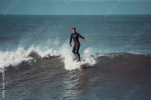 Surfer on a wave in Devon