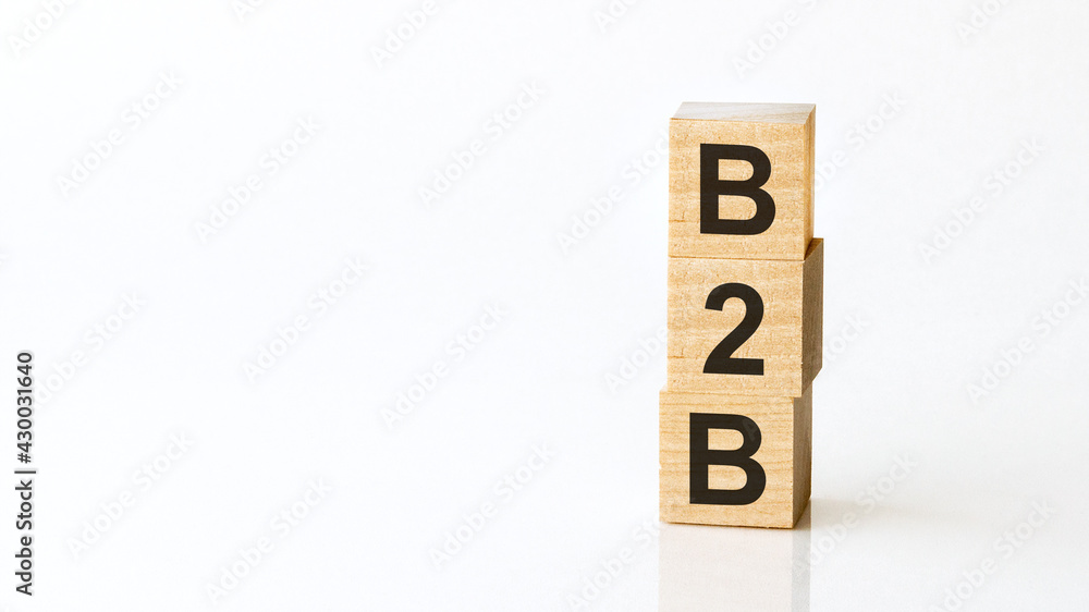 b2b - acronym from wooden blocks with letters, business to business. White background. b2b - acronym from wooden blocks with letters, business to business. White background.