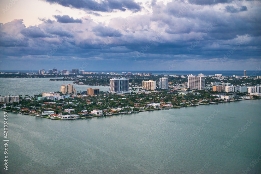 Amazing helicopter aerial view of Miami coastline at winter sunset, Florida